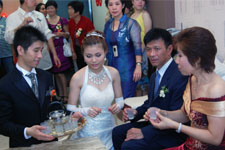 After the wedding ceremony, the bride serves tea to the groom's parents. Photo courtesy of Ms. Zyndee Co