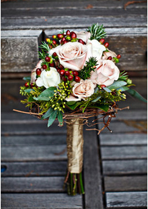 Bridal Bouquet with twigs, pine and berries from projectweddings.com