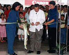 Ralyn Pigar of Visions and Ideas Events Management leads the ribbon-cutting ceremony of Weds Events at the Mega with husband Michael (in blue) and Pastor Butch de Leon (middle)