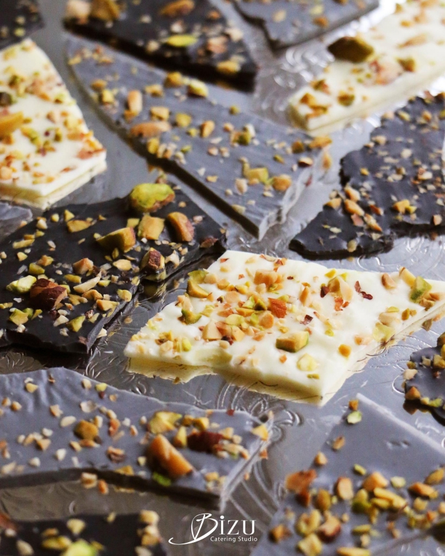 white milk and dark chocolate mendiant bark with crushed pistachios bizu catering studio