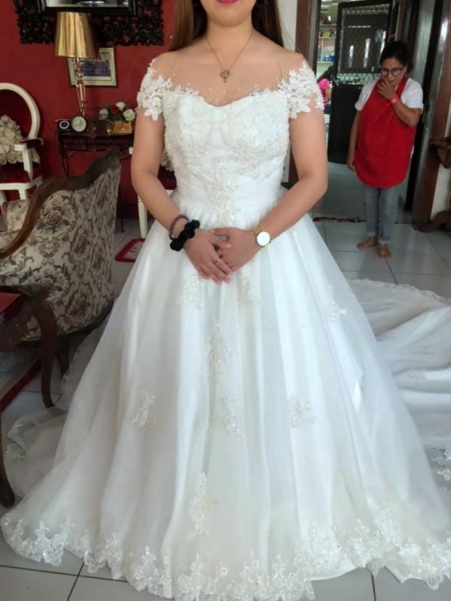 Wedding dress by New Creation Fashion By Evelyn G. Guerrero