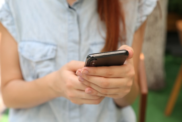 woman holding phone